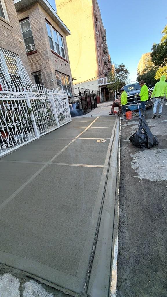 Completed sidewalk concrete project at 1437 Nelson Avenue Bronx NY